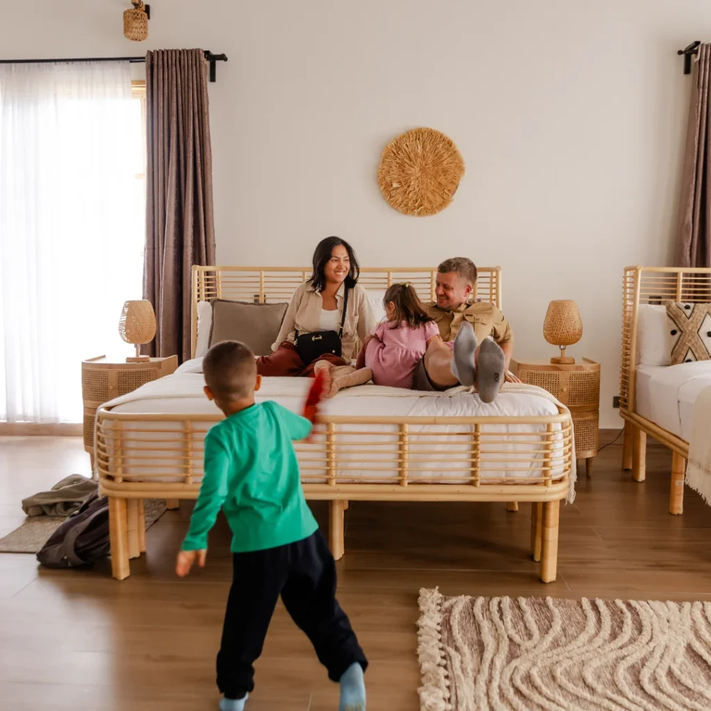 Family relaxing in a safari lodge room