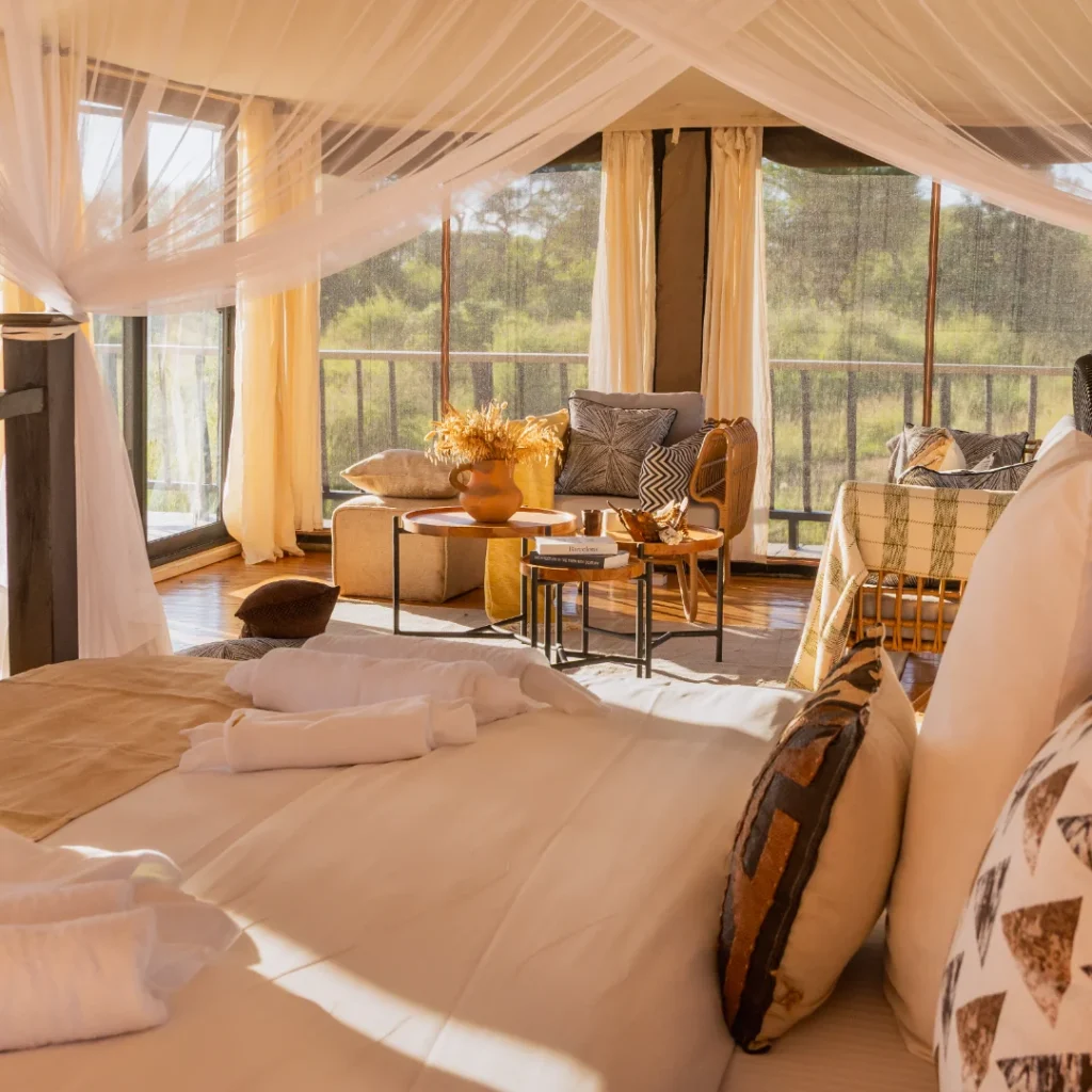 Sunlit bedroom inside a Serian safari tent