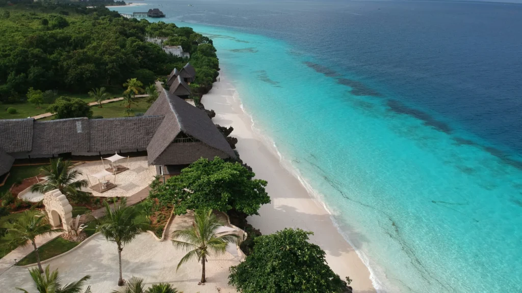 Aerial view of a tropical Zanzibar beach resort and turquoise Indian Ocean